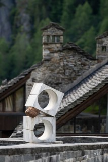 Modern sculpture, old stone house in the background, Rustico, Mogno, Maggia Valley, Valle Maggia,