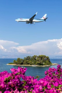A TUI Airways Boeing 737-800 aircraft with the license plate G-TAWX at Corfu airport, Greece