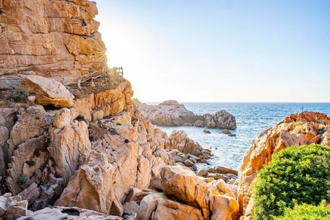 Landscape of the coastline with blue water at Costa Paradiso on a sunny day at evening, Sardinia,