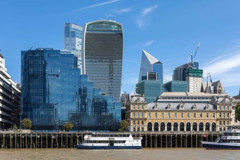 Historic architecture Old Billingsgate fish market building contrast with modern skyscrapers, River