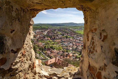 View of the town of Rupea, Transylvania, Romania, through an opening of the wall of Rupea Fortress