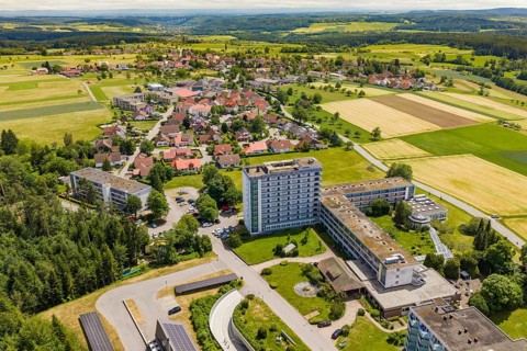 Aerial view of a village with residential buildings and vast fields, Wart, Altensteig, Germany