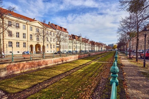 Old city canal, drained historic canal, historic residential buildings, residential buildings,