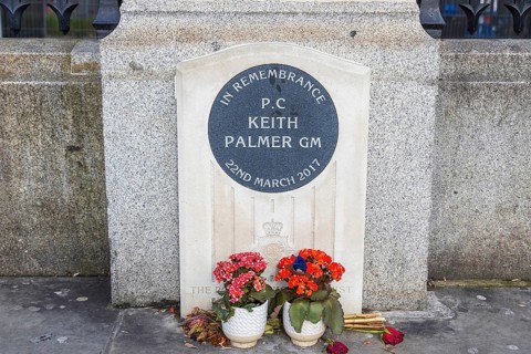 A stone memorial with floral tributes honours PC Keith Palmer, killed outside the Houses of