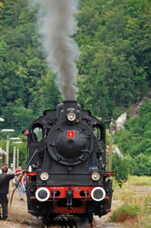Water intake of a steam locomotive at the train station, special steam locomotive trip in
