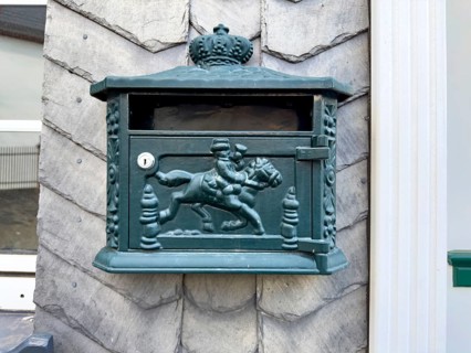 Postbox with historical Postreiter motif, Germany