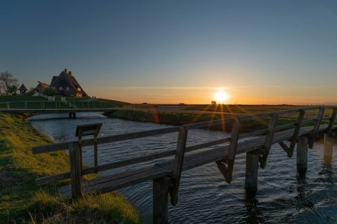 Kirchwarft with pastor and church on Hallig Hooge in the Schleswig-Holstein Wadden Sea National