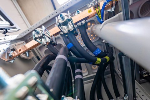 Insulated cables and copper connections within an electrical housing, electrical system for PV