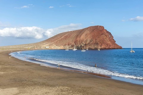 Playa de la Tejita beach with Montana Roja mountain vacation trip in Tenerife La Tejita, Spain