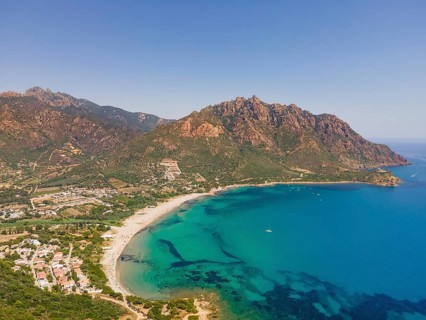 A cloudless blue sky shines over Foxi Manna beach, renowned throughout Europe, in the municipality