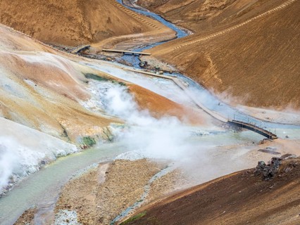 Hiking path, steaming hot springs and colourful rhyolite mountains, Hveradalir geothermal area,