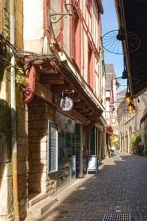 Half-timbered houses in the narrow, cobbled Rue des Halles in the old town of Vannes, Brittany.
