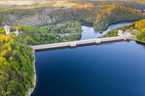 Aerial view of the Rappbode dam, dam wall and suspension bridge by Harzdrenalin, Oberharz am