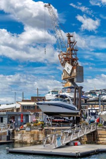 A boat being loaded onto the dry stack at the marina berth on Cockatoo Island, Sydney, Australia