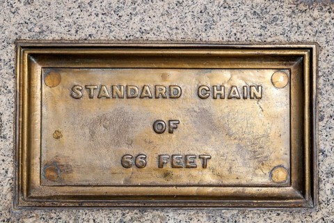 The Standard Chain of 66 Feet plaque is one of the Imperial Standards of Length set into the wall