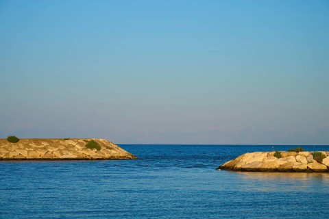 Clear sky and calm sea between two rocky coastlines, marina, Evrenseki, Manavgat, Antalya, Turkish