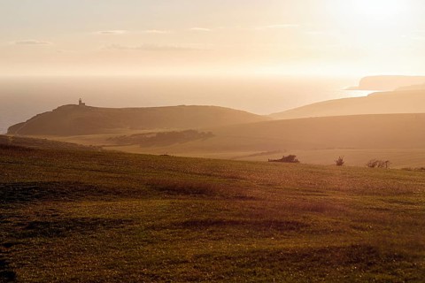 View from above of the coast and Belle Tout lighthouse, sunset, Eastbourne, South Downs, East