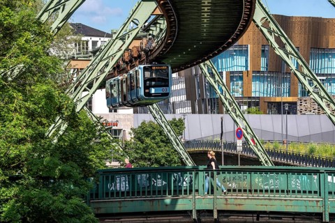 The Wuppertal suspension railway runs above along the Wupper River, between the central railway