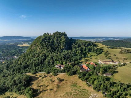 Aerial view of the Hohentwiel volcanic cone with Germany's largest fortress ruin, in the morning