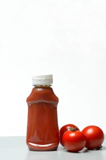 Ketchup, ketchup bottle and tomatoes