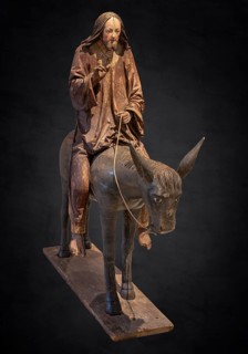 Palm tree donkey, wooden figure from around 1520, on a dark background, Diocesan Museum,