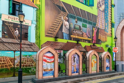 Contemporary street art on Muscat Street recalls Omani maritime culture near Sultan Mosque in