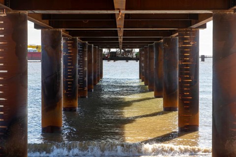 Underneath temporary pier Marine Bulk Import Facility MBIF jetty construction of Sizewell C nuclear