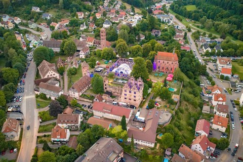 Village view with festival in the midst of historic buildings and surrounding residential