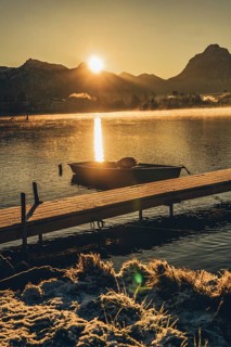 Frosty morning atmosphere during sunrise at Lake Hopfensee in the Allgäu in Bavaria, Germany