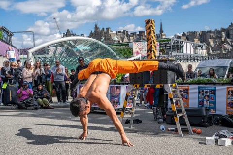 Street performers and spectators, acrobatic performance, Prince Street, world's largest cultural