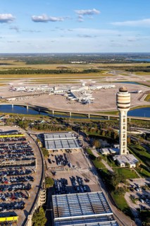 Aerial view of Orlando International Airport with Terminal Concourse Airside 4 and Tower in