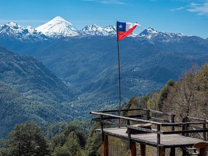 Viewpoint at trail to heart-shaped lake Laguna Corazon, chilenean flag, near Liquine, Chile