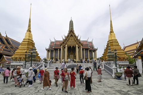 Tourists at Wat Phra Kaew, Temple of the Emerald Buddha, Bangkok, Thailand