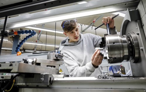 Remscheid, North Rhine-Westphalia, Germany - Trainees in metal professions, here at a machine tool,