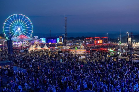 Adenau, Germany, 7 June 2024: Fans enjoy the Rock am Ring Festival during the blue hour. The