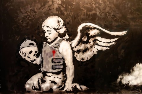 Banksy - Ozone's Angel, Angel with bulletproof vest as a symbol of loss and remembrance of the