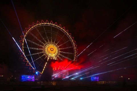 Night shot, rehearsal for New Year's Eve party, theatre, laser show, light show, Ferris wheel,