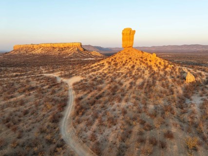 The Vingerklip (rock finger) and the Ugab Valley Terraces are surrounded by thornbush and mopane
