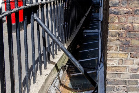 A Victorian penny chute set into the railings once let passers by donate coins to the House of