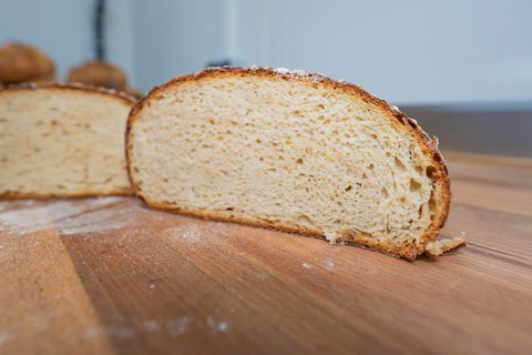 Sliced bread on a wooden background in a kitchen, baking bread, Haselstaller Hof, Gechingen, Calw