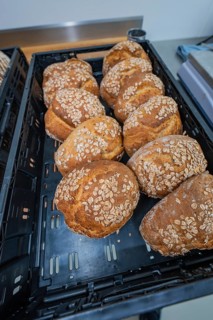 Several rolls sprinkled with oats in a basket, baking bread, Haselstaller Hof, Gechingen, Calw
