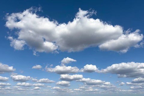 White cumulus cluster clouds cumulus clouds fair weather clouds above tearing torn cumulus fractus