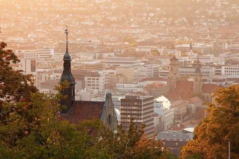 30.09.2018: Stuttgart city panorama at sunset with Collegiate Church and St. Leonhard Church towers
