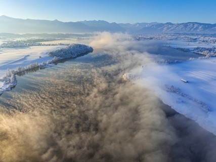 Aerial view of a lake in front of mountains, winter, snow, morning light, fog, Riegsee, Alpine