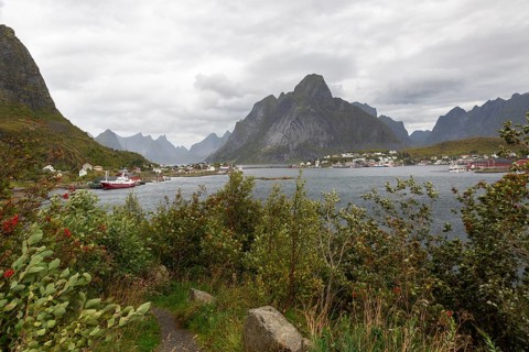 Panoramic view over the fjord of the village of Reine and the distinctive mountain Olstinden under