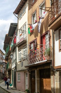 Street of historic buildings with balconies, Rua Egas Montiz, city centre Guimaraes, northern