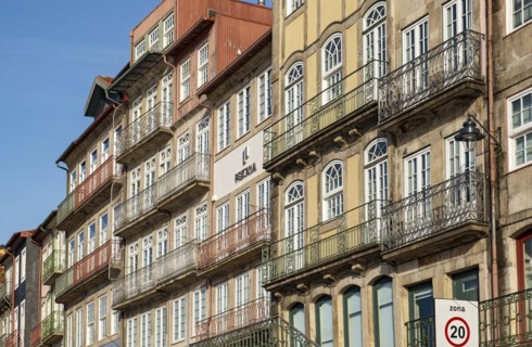 Colorful facades of houses along Cais da Estiva in the Ribeira district, Porto, Portugal