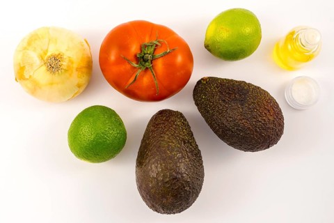 Two good avocados, two limes, an onion, salt and olive oil, and a tomato. Recipe to make a nice