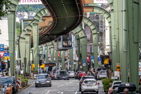 Train of the Wuppertal suspension railway runs along Kaiserstraße in the Wuppertal-Vohwinkel
