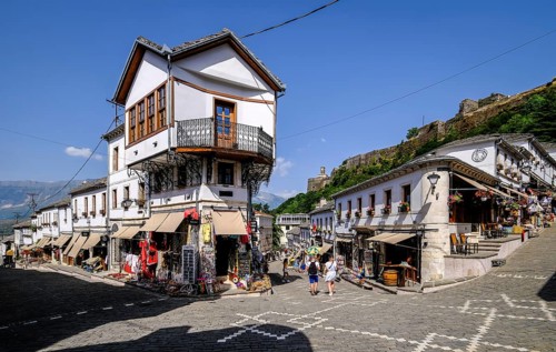 City of Gjirokastra, Gjirokastra, Albania, Tourists visit the historic centre of the mountain city